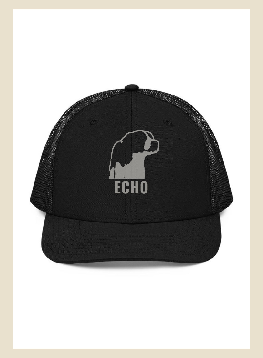 Trucker cap with a dog stitched on the front